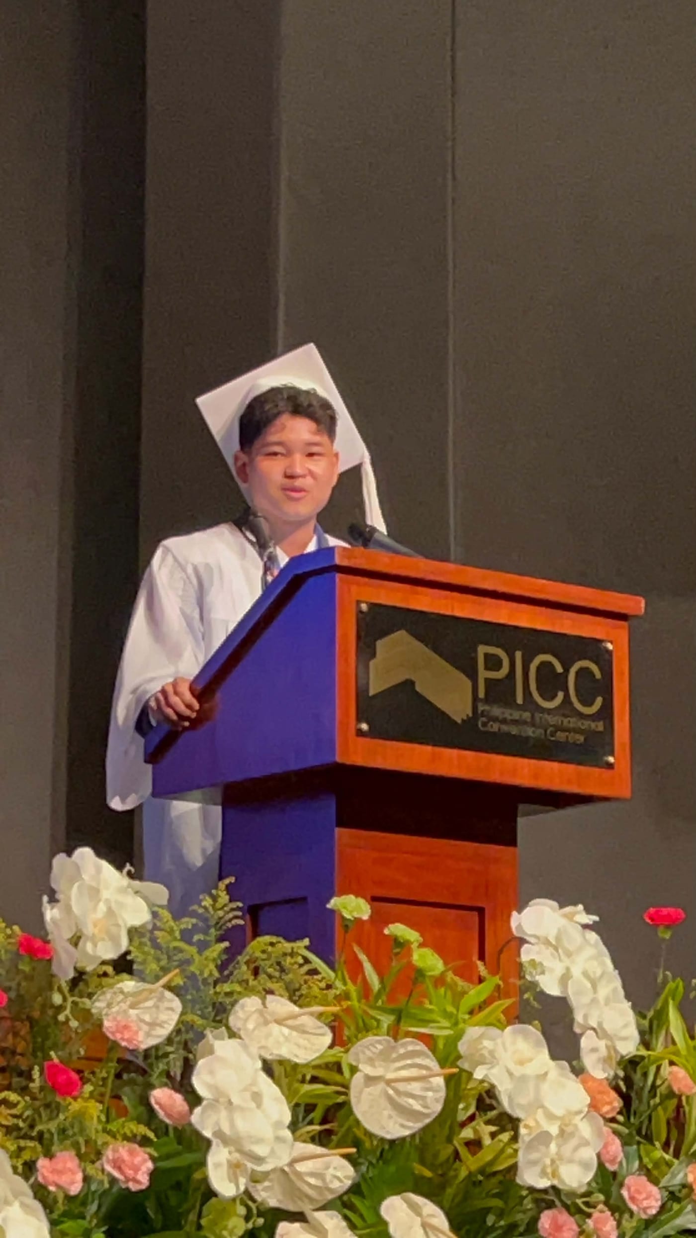 Ethan Owen Taruc delivering a graduation address at the Philippine International Convention Center